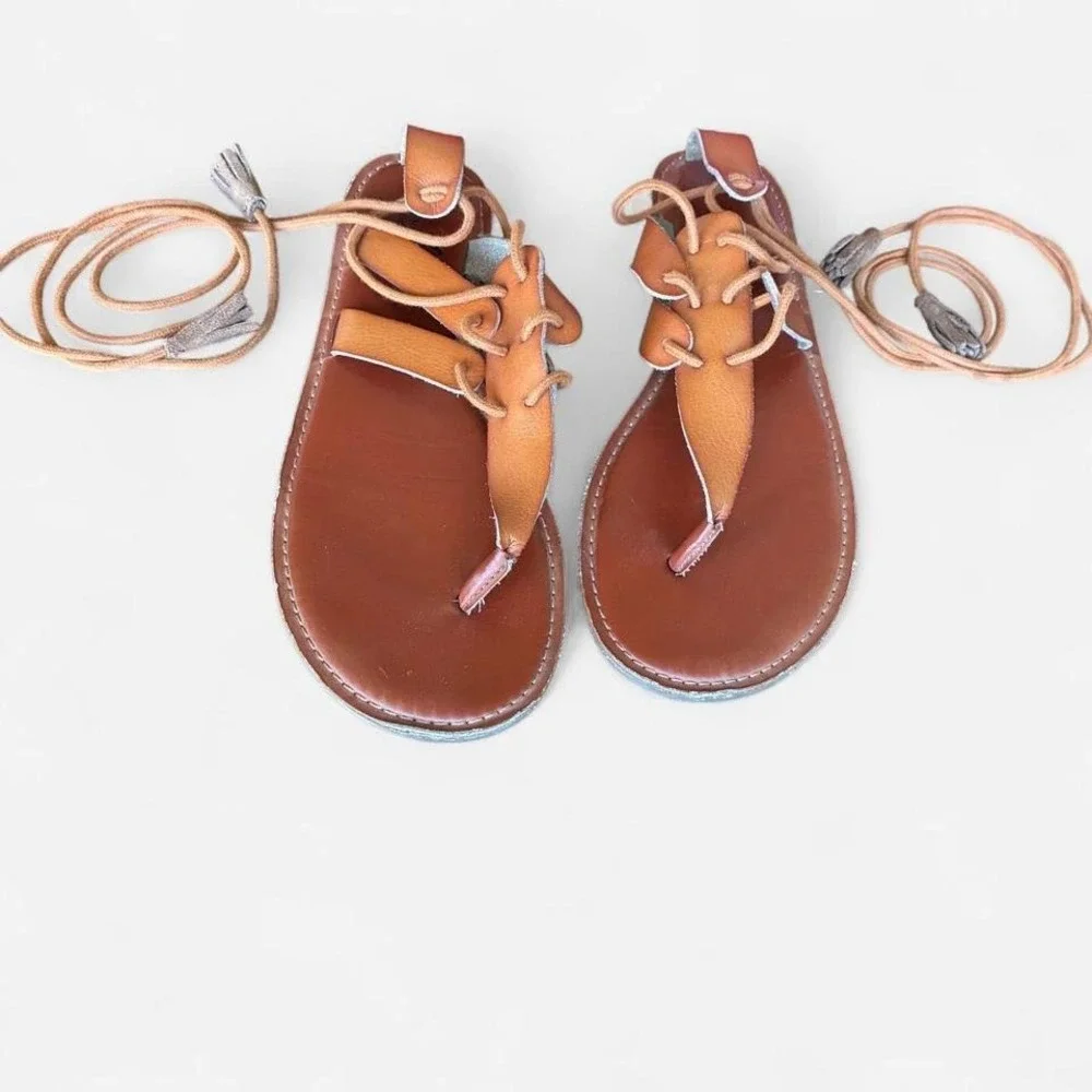 American Eagle Wrap Tan Leather-like Sandals‎ Sz 9 w/ tassel detail